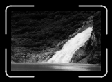 ealy_MendenhallGlacier_WaterfallAndTourists * 900 x 602 * (123KB)